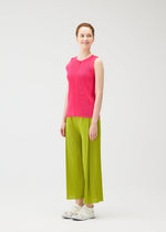 A model wears the PLEATS PLEASE ISSEY MIYAKE MIST JUNE mist-june-shirt-yellow-green.