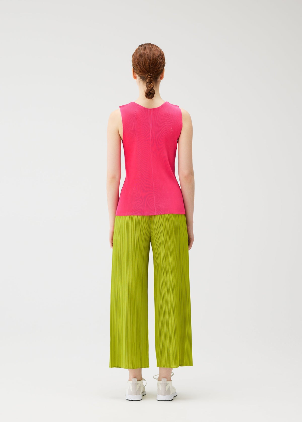 A model wears the PLEATS PLEASE ISSEY MIYAKE MIST JUNE mist-june-shirt-yellow-green.
