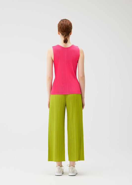 A model wears the PLEATS PLEASE ISSEY MIYAKE MIST JUNE mist-june-shirt-bright-pink.