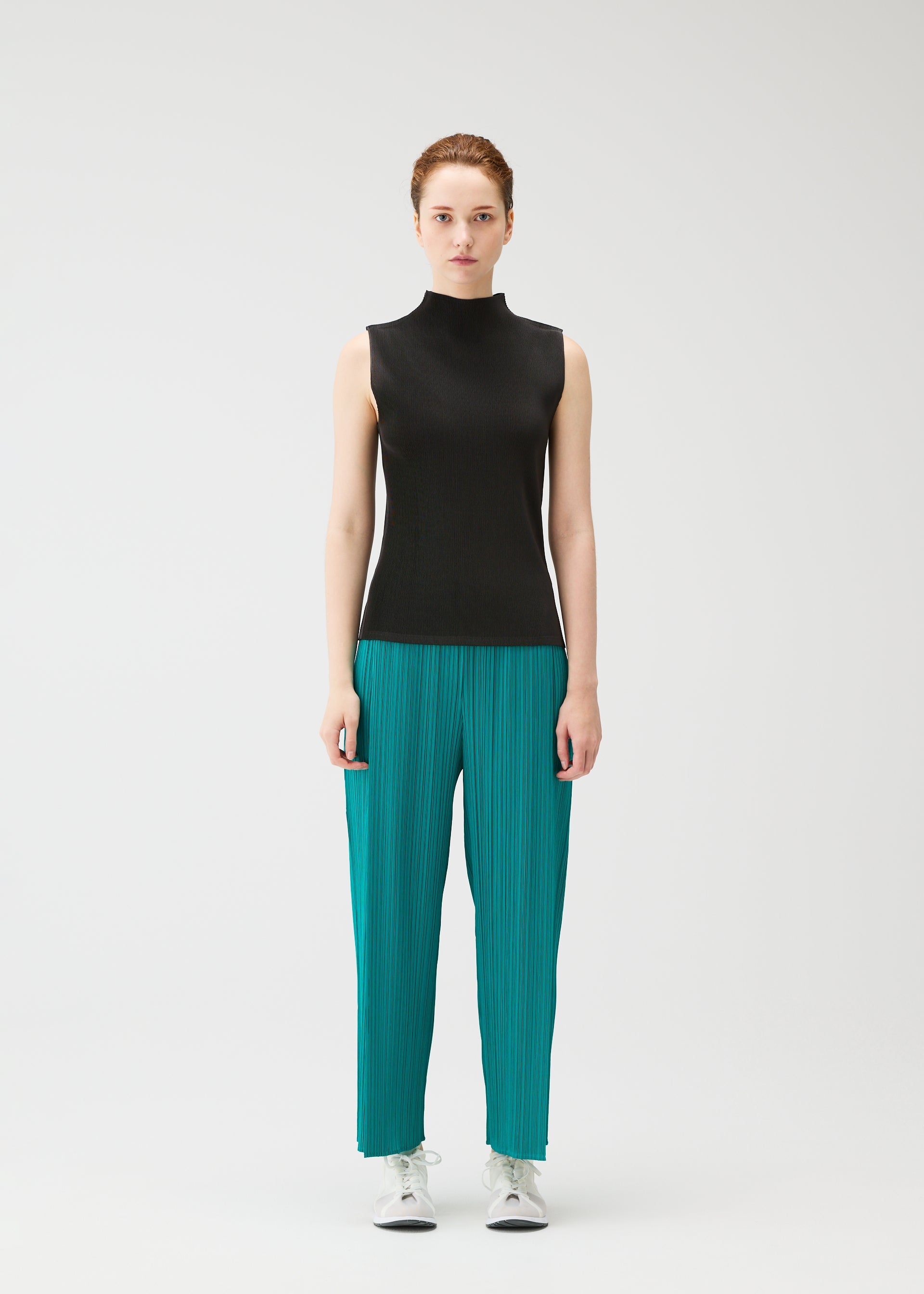 A model wears the PLEATS PLEASE ISSEY MIYAKE MIST JUNE mist-june-shirt-yellow-green-1.