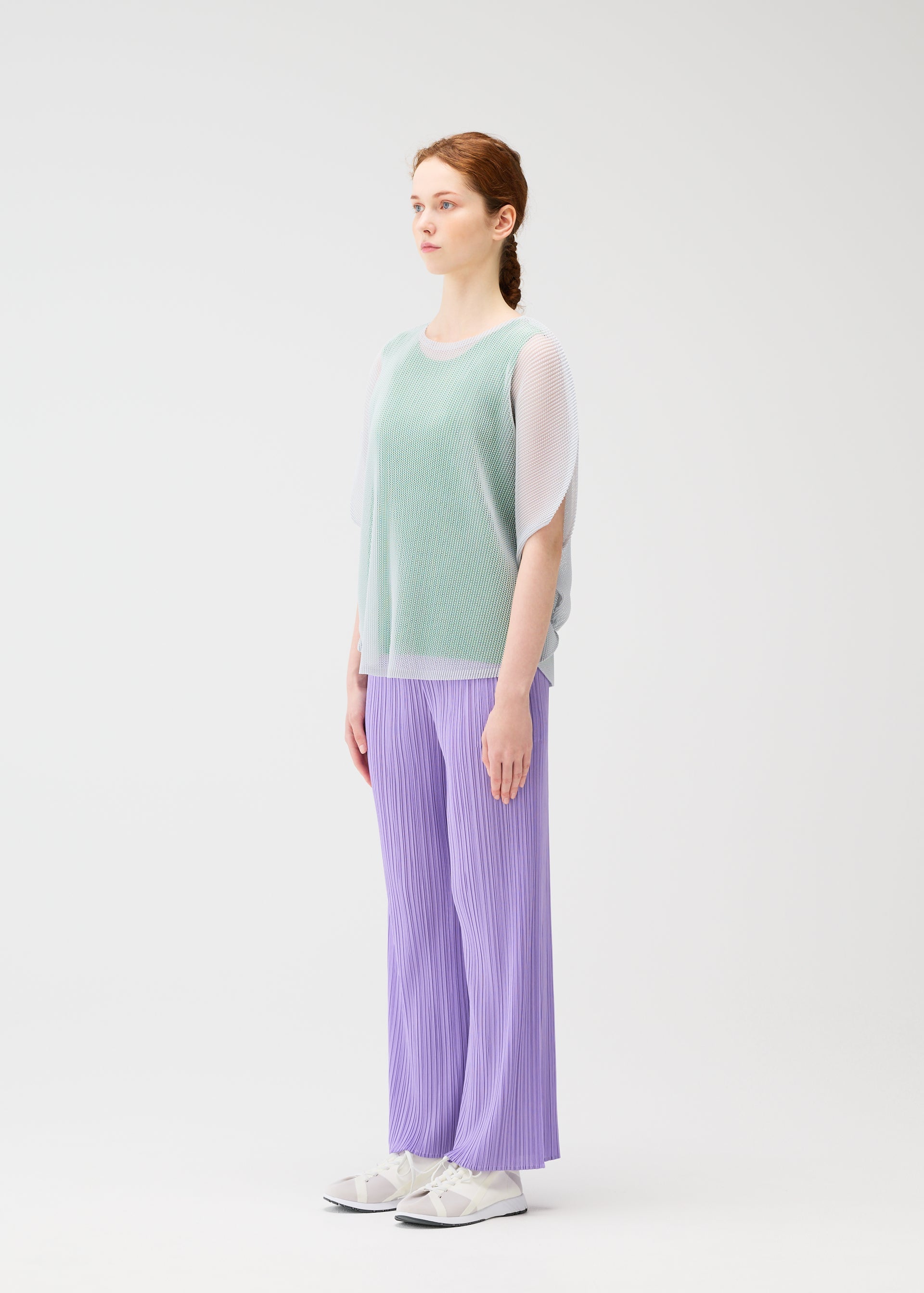 A model wears the Pleats Please Issey Miyake TATAMI APRIL shirt.