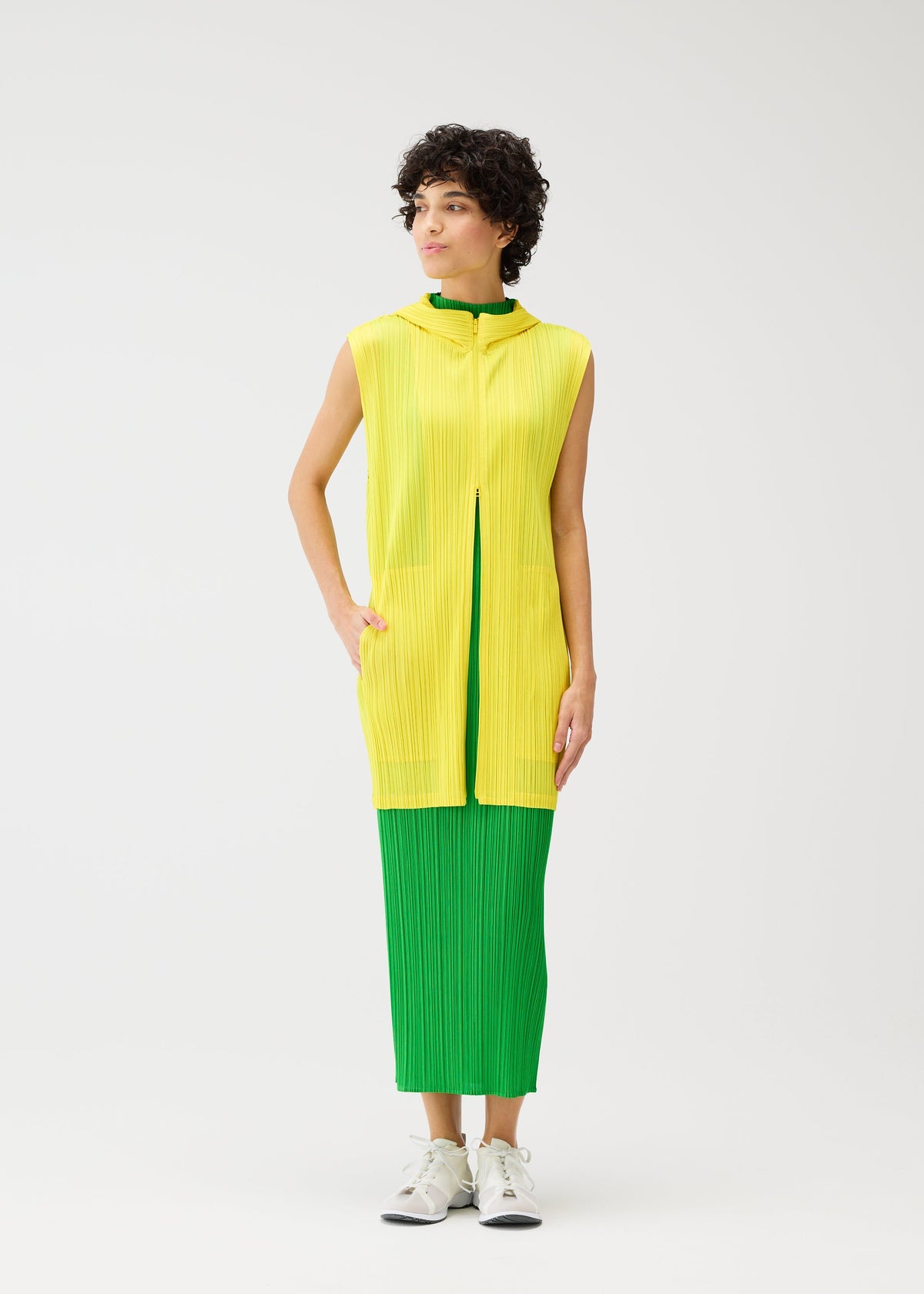 A model wears the Pleats Please Issey Miyake MONTHLY COLORS vest.