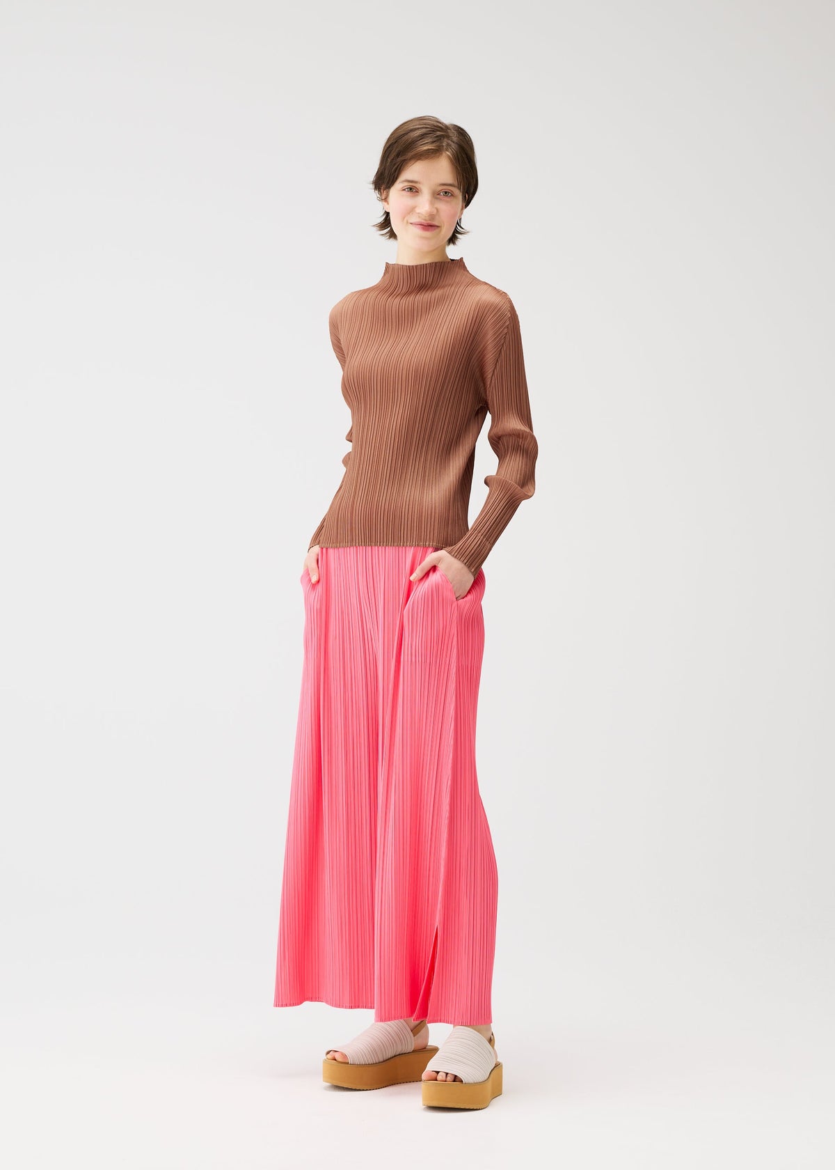 A model wears the Pleats Please Issey Miyake MONTHLY COLORS MARCH prêt à porter.
