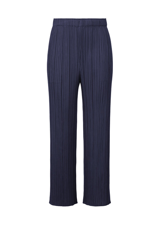 A product shot of the Pleats Please Issey Miyake MONTHLY COLORS MAY trousers in navy (75), recurring_style.