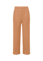 A product shot of the PLEATS PLEASE ISSEY MIYAKE MONTHLY COLORS : JUNE trousers in pink beige.