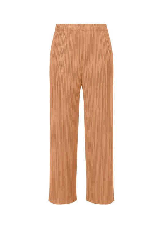A product shot of the PLEATS PLEASE ISSEY MIYAKE MONTHLY COLORS : JUNE trousers in pink beige.