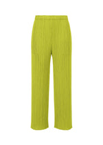 A product shot of the PLEATS PLEASE ISSEY MIYAKE MONTHLY COLORS : JUNE trousers in yellow green.