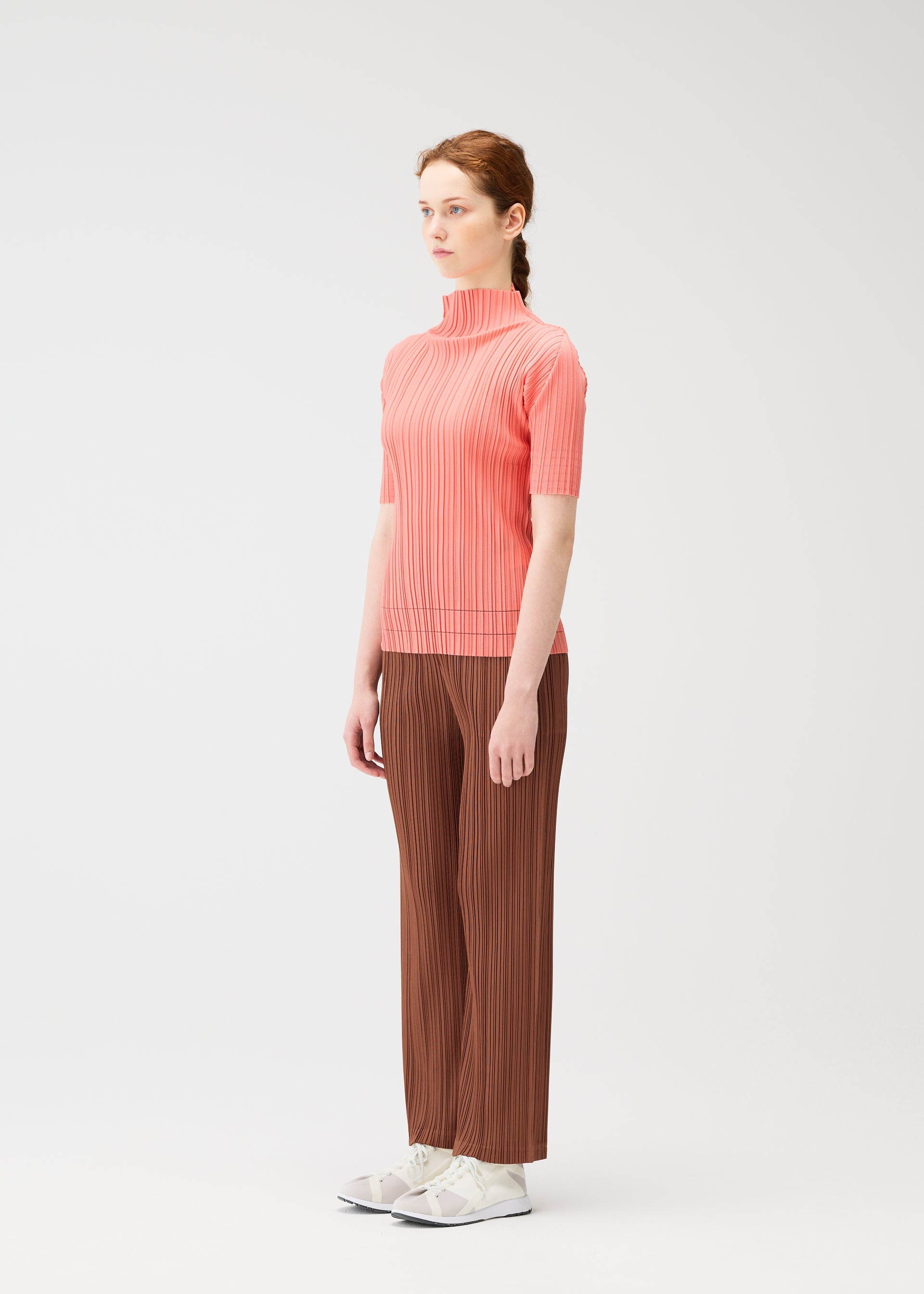 A model wears the Pleats Please Issey Miyake THICKER BOTTOMS 2 prêt à porter.