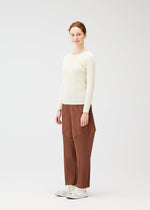 A model wears the Pleats Please Issey Miyake THICKER BOTTOMS 2 prêt à porter.