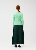 A model wears the Pleats Please Issey Miyake THICKER BOTTOMS 2 prêt à porter.