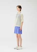 A model wears the Pleats Please Issey Miyake LOOP BOTTOMS trousers.