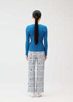 A model wears the PLEATS PLEASE ISSEY MIYAKE CROSSING DOTS prêt à porter.