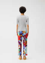 A model wears the Pleats Please Issey Miyake SODA POPS pants.