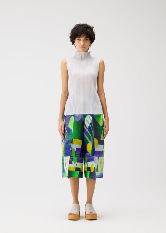 A model wears the Pleats Please Issey Miyake SODA POPS pants.