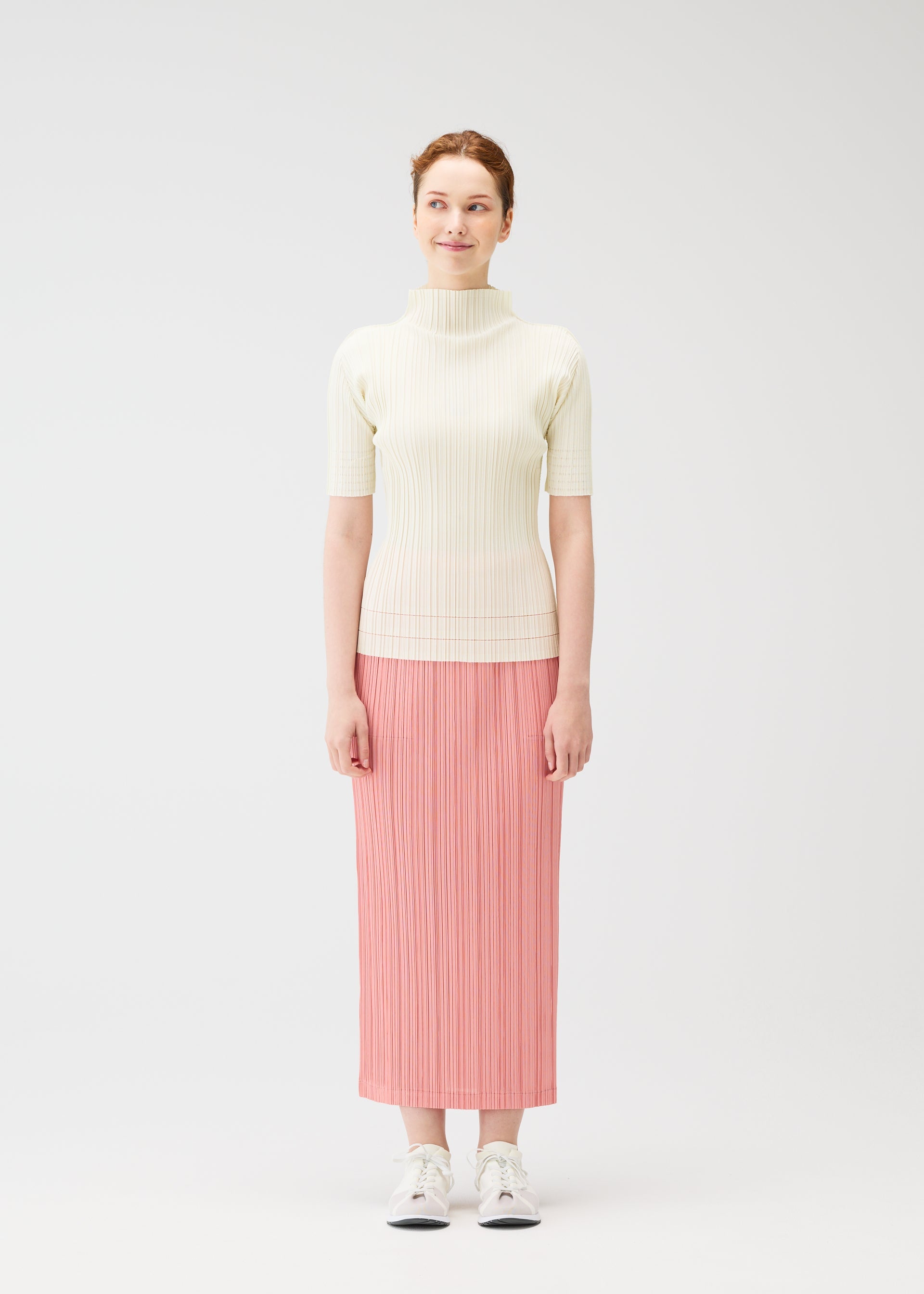 A model wears the Pleats Please Issey Miyake THICKER BOTTOMS 2 prêt à porter.