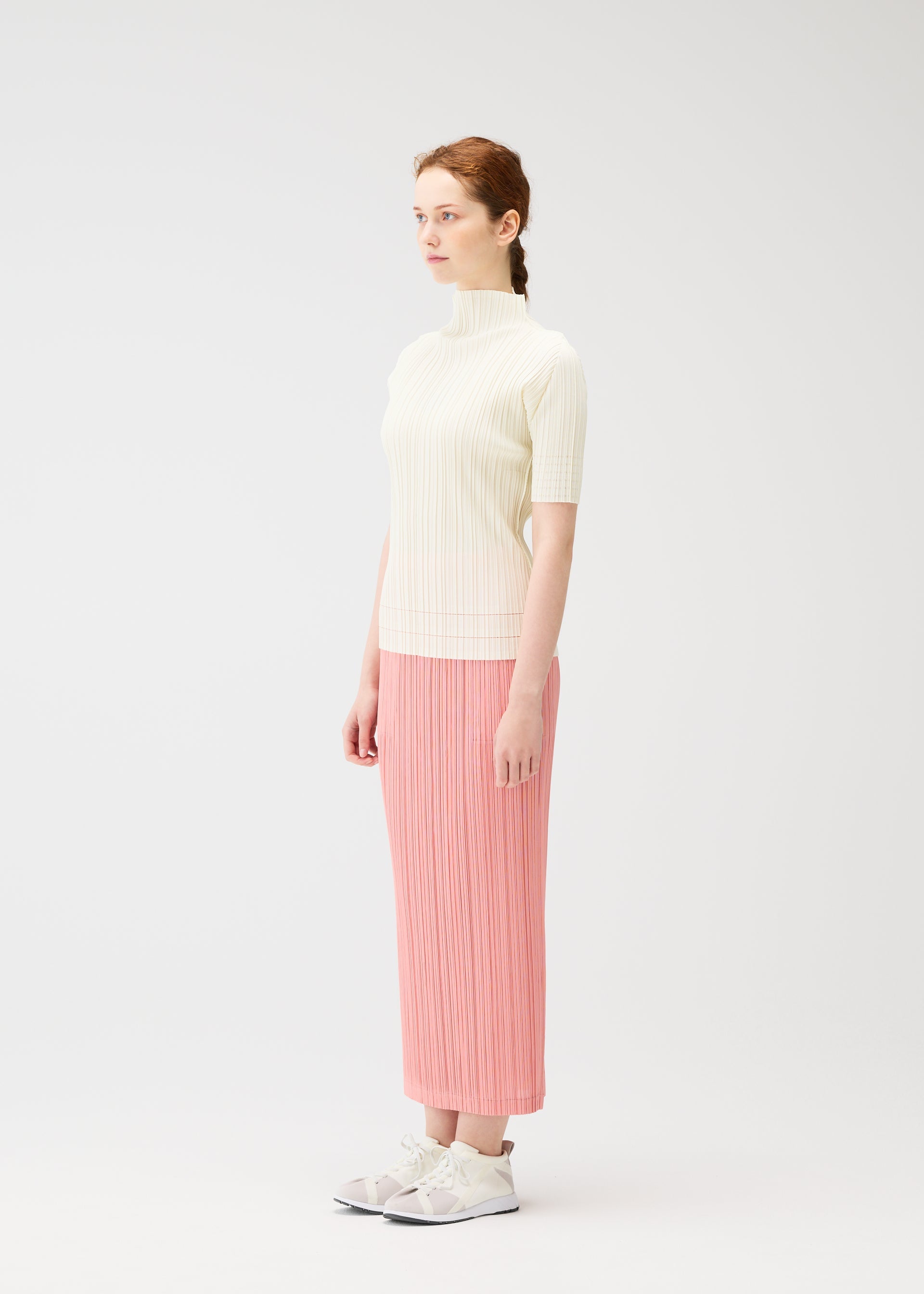 A model wears the Pleats Please Issey Miyake THICKER BOTTOMS 2 prêt à porter.