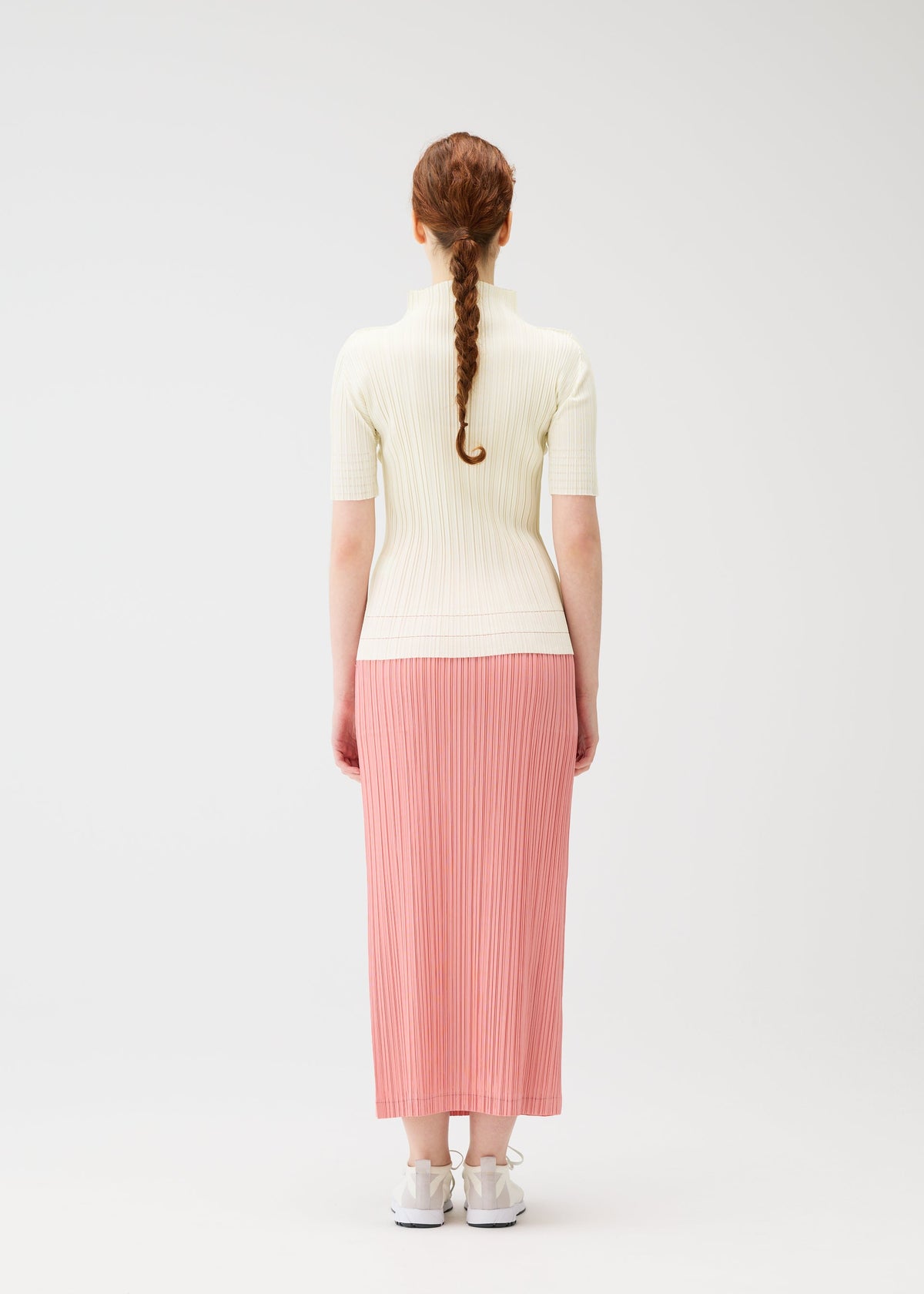 A model wears the Pleats Please Issey Miyake THICKER BOTTOMS 2 prêt à porter.