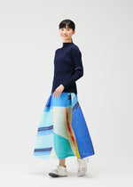A model wears the PLEATS PLEASE ISSEY MIYAKE CITY COLLAGE prêt à porter.