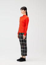 A model wears the PLEATS PLEASE ISSEY MIYAKE CROSSING DOTS prêt à porter.