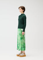 A model wears the Pleats Please Issey Miyake FOGGY FOREST prêt à porter.