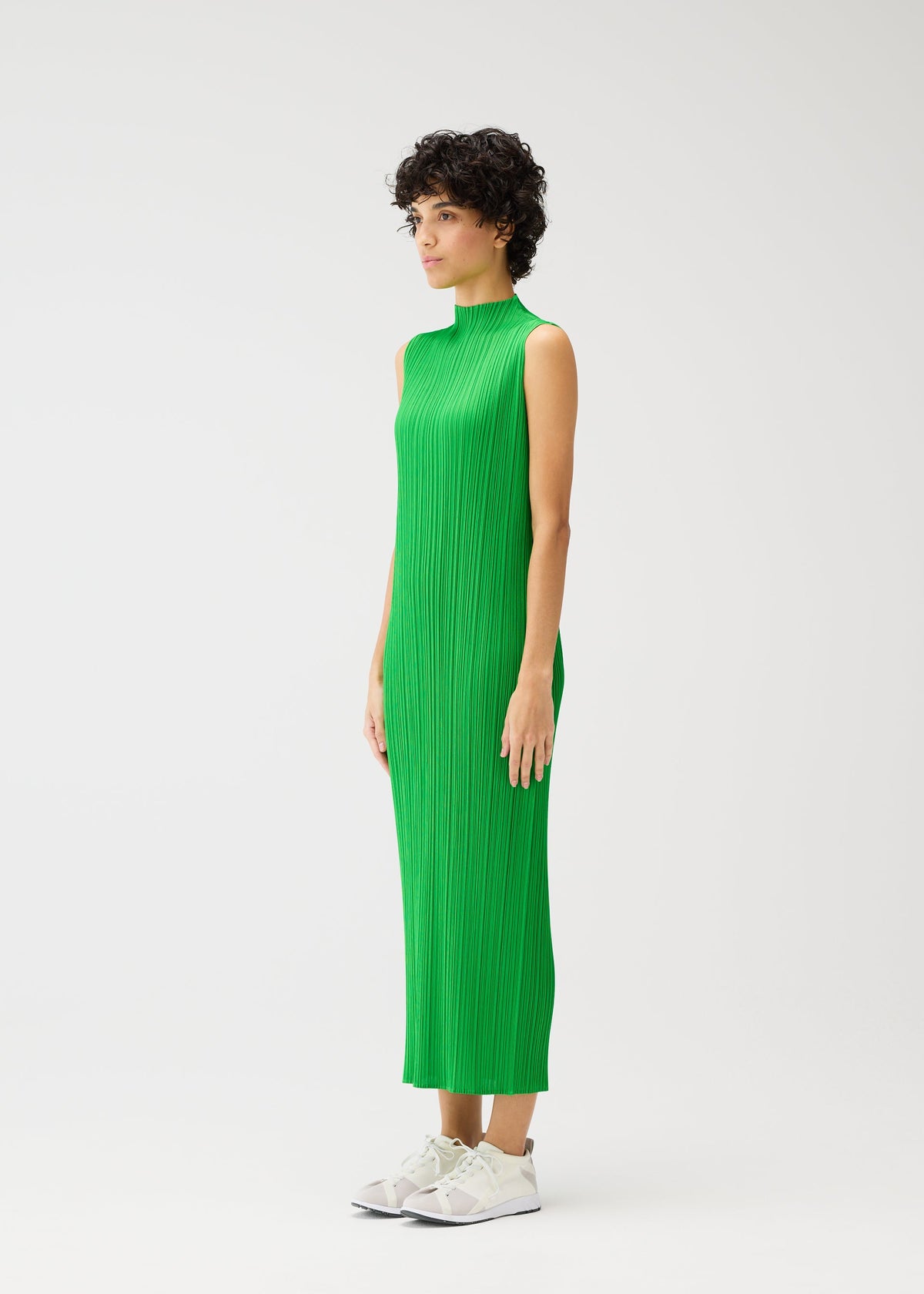 A model wears the Pleats Please Issey Miyake MONTHLY COLORS dress.