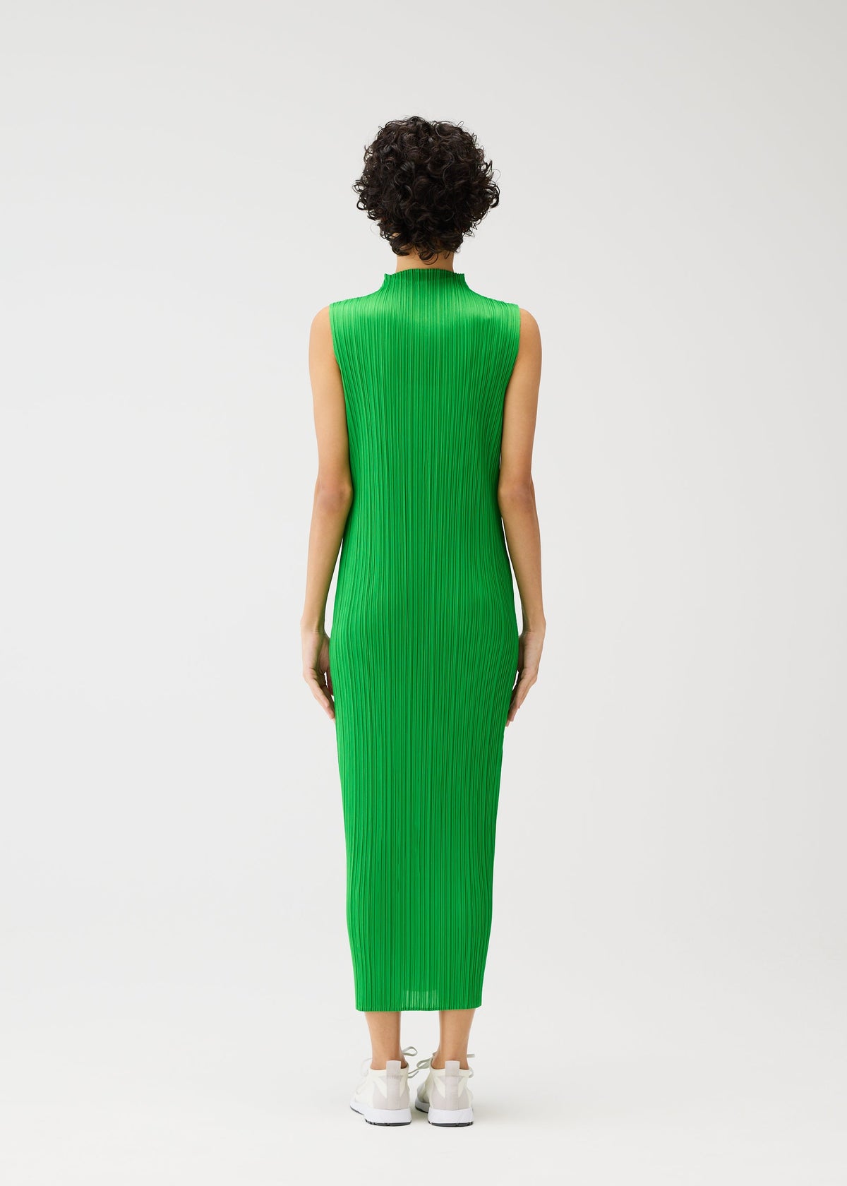 A model wears the Pleats Please Issey Miyake MONTHLY COLORS dress.