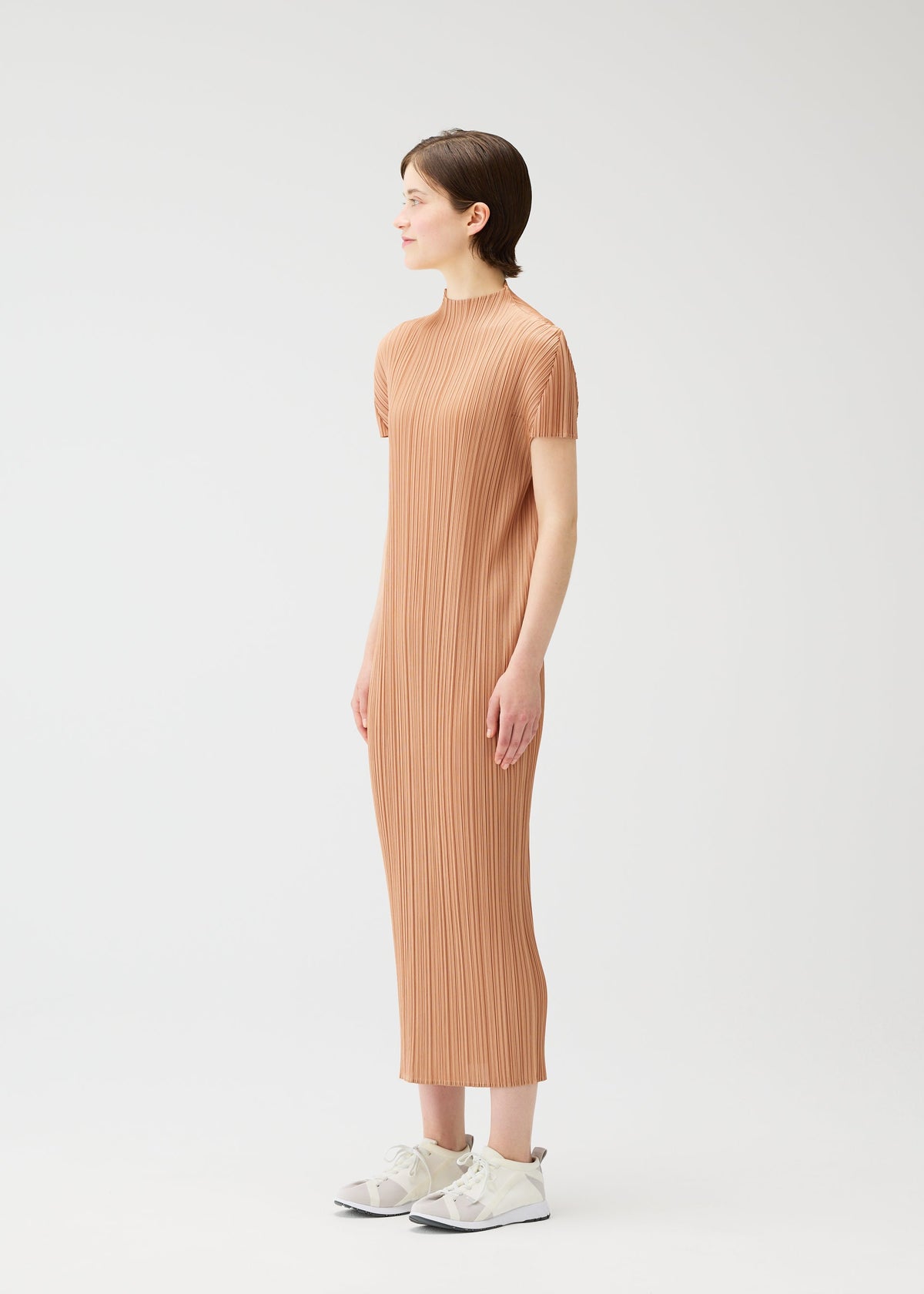 A model wears the PLEATS PLEASE ISSEY MIYAKE MONTHLY COLORS : JUNE monthly-colors-june-dress-yellow-green.