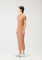 A model wears the PLEATS PLEASE ISSEY MIYAKE MONTHLY COLORS : JUNE monthly-colors-june-dress-blue-green-1.