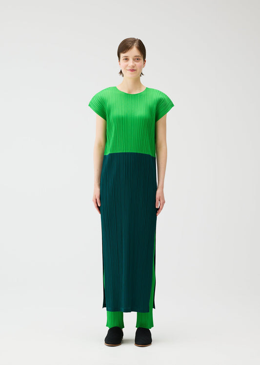 A model wears the Pleats Please Issey Miyake SWING dress.
