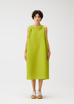 A model wears the PLEATS PLEASE ISSEY MIYAKE BOUNCY BASKET bouncy-basket-dress-yellow-green.