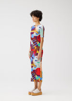 A model wears the Pleats Please Issey Miyake SODA POPS dress.