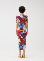 A model wears the Pleats Please Issey Miyake SODA POPS dress.