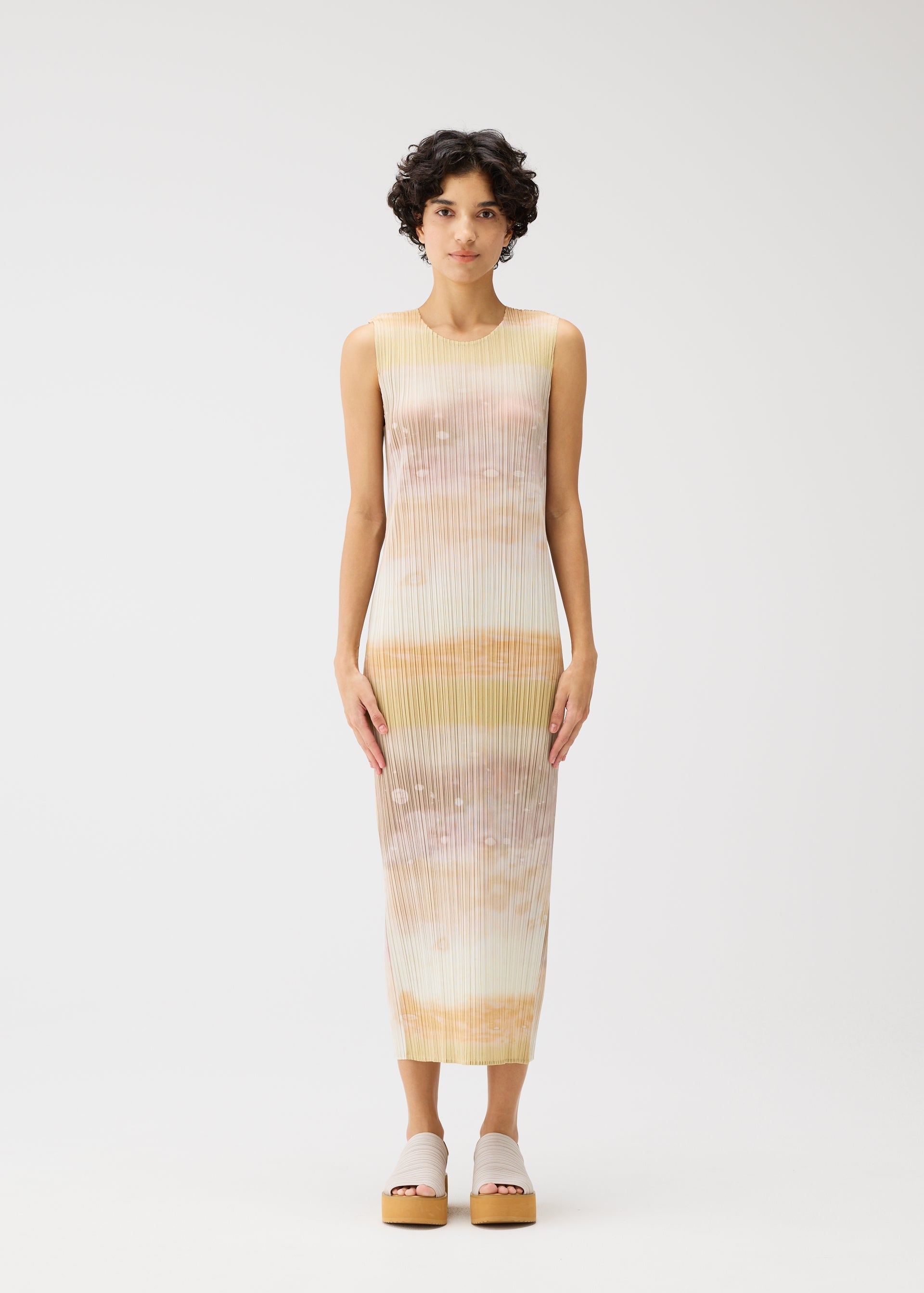 A model wears the Pleats Please Issey Miyake SEA BUBBLE dress.