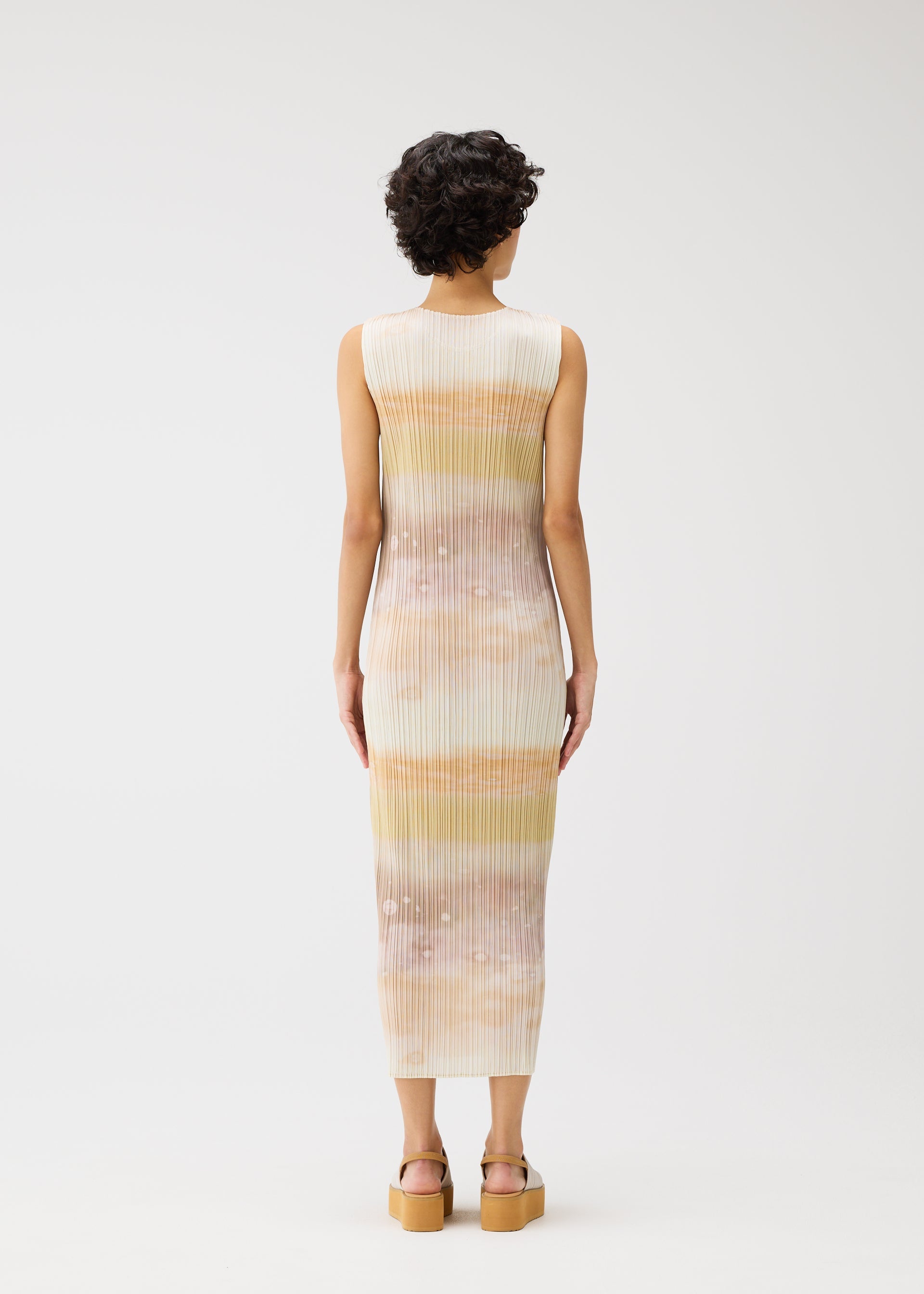 A model wears the Pleats Please Issey Miyake SEA BUBBLE dress.