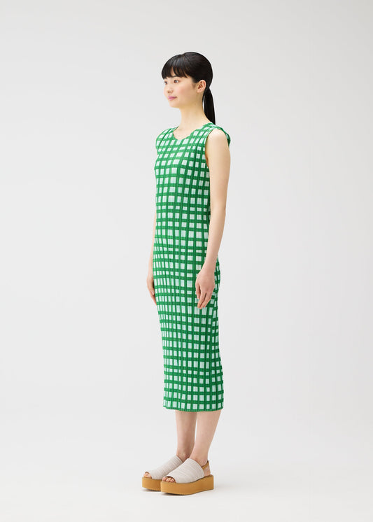 A model wears the PLEATS PLEASE ISSEY MIYAKE BASKET basket-dress-navy.