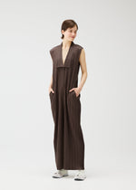 A model wears the Pleats Please Issey Miyake LOOP BOTTOMS jumpsuit.