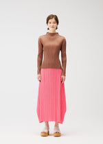 A model wears the Pleats Please Issey Miyake MONTHLY COLORS MARCH prêt à porter.