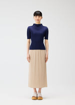 A model wears the Pleats Please Issey Miyake MONTHLY COLORS MAY shirt.