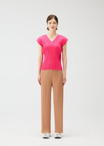 A model wears the PLEATS PLEASE ISSEY MIYAKE MONTHLY COLORS : JUNE monthly-colors-june-shirt-bright-pink-1.