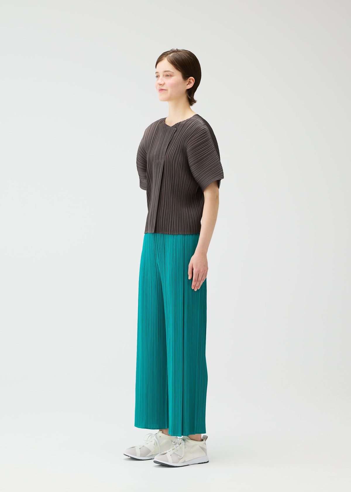 A model wears the PLEATS PLEASE ISSEY MIYAKE MONTHLY COLORS : JUNE monthly-colors-june-shirt-bright-pink-3.
