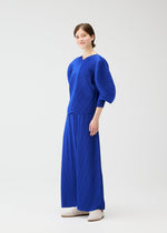 A model wears the PLEATS PLEASE ISSEY MIYAKE COAST pp66jk46143os.