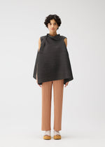 A model wears the PLEATS PLEASE ISSEY MIYAKE BOUNCY BASKET bouncy-basket-shirt-yellow-green.
