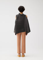A model wears the PLEATS PLEASE ISSEY MIYAKE BOUNCY BASKET bouncy-basket-shirt-yellow-green.
