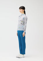 A model wears the PLEATS PLEASE ISSEY MIYAKE CROSSING DOTS prêt à porter.