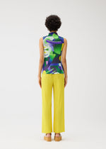 A model wears the Pleats Please Issey Miyake SODA POPS shirt.