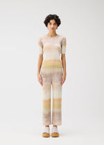 A model wears the Pleats Please Issey Miyake SEA BUBBLE top.