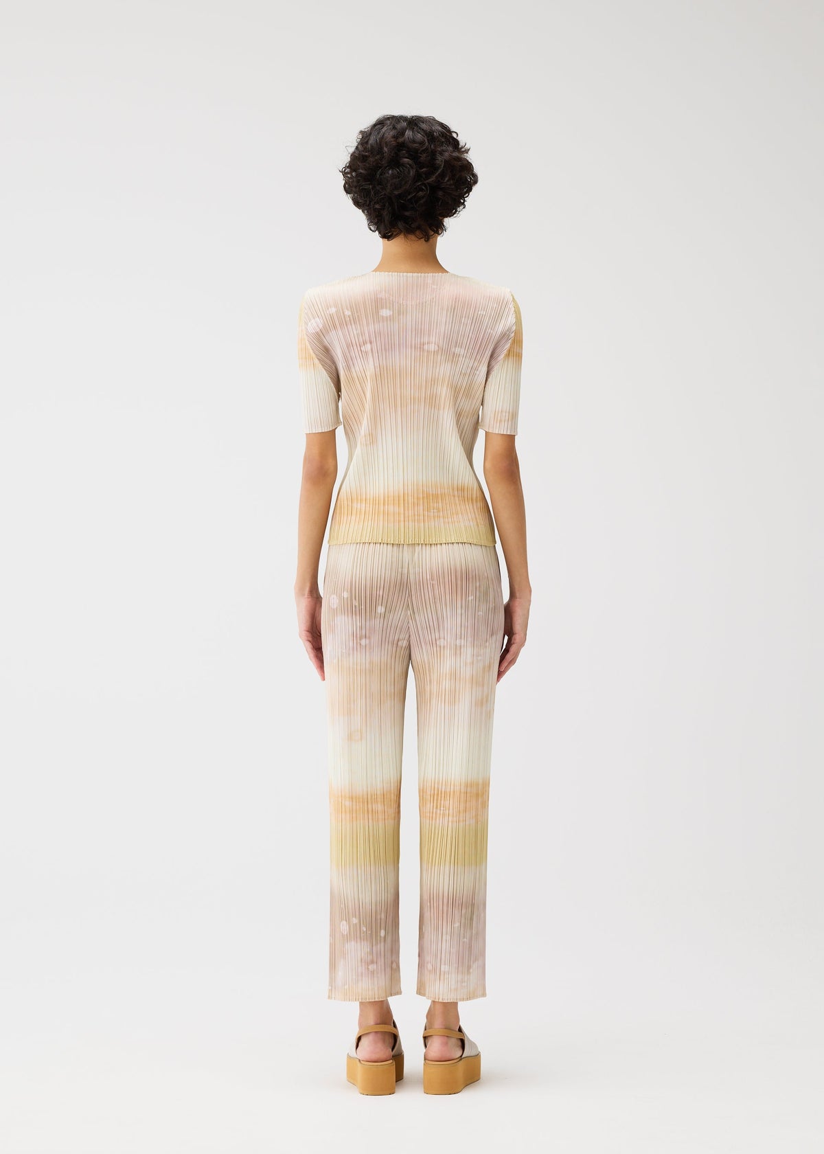 A model wears the Pleats Please Issey Miyake SEA BUBBLE top.