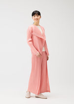 A model wears the Pleats Please Issey Miyake RAMIE PLEATS prêt à porter.