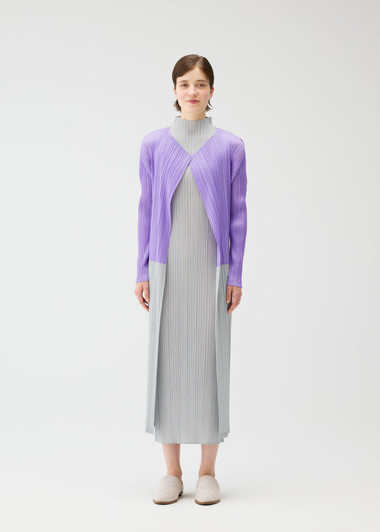 A model wears the Pleats Please Issey Miyake SWING cardigan.