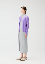 A model wears the Pleats Please Issey Miyake SWING cardigan.